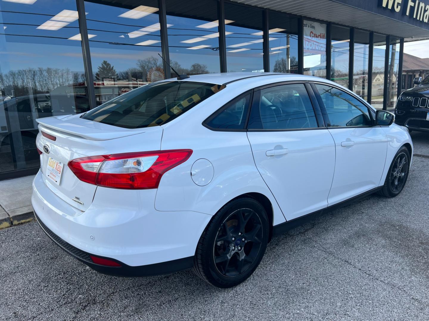 2014 Oxford White Ford Focus SE Sedan (1FADP3F26EL) with an 2.0L L4 DOHC 16V engine, 6-Speed Automatic transmission, located at 1633 W Kimberly, Davenport, IA, 52806, (563) 323-5341, 41.559456, -90.598732 - Photo#3